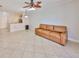 Living room with tile flooring, recessed lighting, and open access to the kitchen at 2739 Via Capri # 1024, Clearwater, FL 33764