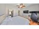 Bedroom with a ceiling fan, wood floors, and a walk-in closet at 2739 Via Capri # 1024, Clearwater, FL 33764