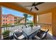 Relaxing outdoor patio with seating and a ceiling fan overlooking a beautifully landscaped complex at 2739 Via Capri # 1024, Clearwater, FL 33764