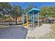 Community playground with colorful equipment and soft sand, inviting children to play and explore at 2739 Via Capri # 1024, Clearwater, FL 33764