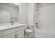 Bathroom with white vanity, tiled shower, and modern fixtures at 28776 Rambutan Dr, Wesley Chapel, FL 33543
