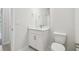 Cozy bathroom featuring a white vanity and toilet at 28776 Rambutan Dr, Wesley Chapel, FL 33543