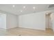 Neutral open living space with light wood floors, natural light and access to a patio at 28776 Rambutan Dr, Wesley Chapel, FL 33543