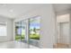 Bright living room featuring sliding glass doors, providing seamless indoor-outdoor living at 28776 Rambutan Dr, Wesley Chapel, FL 33543