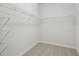 Spacious walk-in closet with ample shelving for organization and storage at 28776 Rambutan Dr, Wesley Chapel, FL 33543