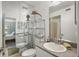 Bright bathroom with double sinks, granite countertop, mirrored wall and decorative sea life at 3001 58Th S Ave # 509, St Petersburg, FL 33712