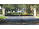 Elegant black iron entrance gate with decorative blue circles, ensuring privacy and security at 3001 58Th S Ave # 509, St Petersburg, FL 33712
