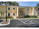 Two-story condo with a loading zone parking spot, stairs to the second floor, and light yellow paint at 3001 58Th S Ave # 509, St Petersburg, FL 33712