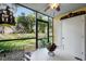 Relaxing screened patio area with outdoor seating, dining table, and scenic views of the lush green backyard at 3001 58Th S Ave # 509, St Petersburg, FL 33712