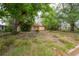Charming home with mature trees and lush greenery provides a peaceful setting with loads of potential at 3027 W Helen Ave, Tampa, FL 33611