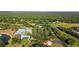 Discover a vibrant community with tennis courts, a pool, playgrounds, and lush green spaces from above at 3329 Cypress Landing Dr, Valrico, FL 33596