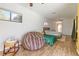 Bright bedroom with wood-look flooring, natural light, and comfortable furnishings at 3329 Cypress Landing Dr, Valrico, FL 33596