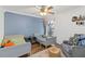 bedroom with two beds, soft chair, and a calming color palette at 3329 Cypress Landing Dr, Valrico, FL 33596