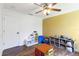 Bright room featuring stylish ceiling fan, charming decor, and hardwood flooring at 3329 Cypress Landing Dr, Valrico, FL 33596