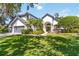 Charming two-story home featuring a well-manicured lawn and elegant landscaping at 3329 Cypress Landing Dr, Valrico, FL 33596