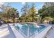 Enjoy the refreshing community pool surrounded by lush landscaping and comfortable lounge chairs at 3329 Cypress Landing Dr, Valrico, FL 33596