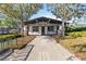Inviting tennis club with stone accents and manicured landscaping at 3329 Cypress Landing Dr, Valrico, FL 33596