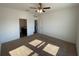 Bedroom features neutral walls, carpeted floors, and a ceiling fan at 35003 Daisy Meadow Loop, Zephyrhills, FL 33541