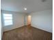 Neutral bedroom featuring fresh paint and plush carpeting at 35003 Daisy Meadow Loop, Zephyrhills, FL 33541