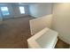A view of a spacious bonus room from the staircase at 35003 Daisy Meadow Loop, Zephyrhills, FL 33541