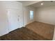 Entryway with door, window, and carpeted area at 35003 Daisy Meadow Loop, Zephyrhills, FL 33541