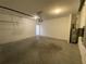 A spacious two-car garage features an automatic door and water heater at 35003 Daisy Meadow Loop, Zephyrhills, FL 33541
