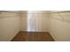 Spacious walk-in closet with wire shelving and carpeted floors at 35003 Daisy Meadow Loop, Zephyrhills, FL 33541