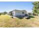 Comfortable home featuring a cozy backyard and screened patio with a lovely neighborhood at 37422 Neukom Ave, Zephyrhills, FL 33541