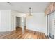 Bedroom showcasing hardwood floors, and a sliding glass door at 37422 Neukom Ave, Zephyrhills, FL 33541