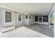 Spacious carport area, offering ample space for parking and outdoor living, with a screened in porch at 37422 Neukom Ave, Zephyrhills, FL 33541