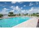 Sparkling community pool with ample lounge seating, perfect for relaxation and neighborhood fun at 37422 Neukom Ave, Zephyrhills, FL 33541