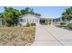 Charming single-story home with a carport and well-maintained lawn in a desirable neighborhood at 37422 Neukom Ave, Zephyrhills, FL 33541