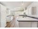 Spacious kitchen with white cabinets, modern appliances, and ample countertop space at 37422 Neukom Ave, Zephyrhills, FL 33541