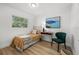 Cozy bedroom with a modern aesthetic and an accent chair that provides a relaxing space at 3936 10Th N Ave, St Petersburg, FL 33713