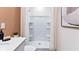Bright bathroom with a walk-in shower, sleek vanity, and modern fixtures at 431 Warm Heron Pl, Ruskin, FL 33570
