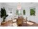 Charming dining room with warm terra cotta flooring, a round table, and plenty of natural light at 432 39Th Ne Ave, St Petersburg, FL 33703