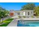 Stunning home exterior featuring a refreshing pool, lush landscaping, and an inviting outdoor space for relaxation and entertainment at 432 39Th Ne Ave, St Petersburg, FL 33703