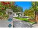 Beautiful home exterior showcasing a meticulously maintained lawn, vibrant landscaping, and a charming entrance at 432 39Th Ne Ave, St Petersburg, FL 33703