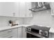 Updated kitchen with stainless steel appliances, white cabinetry, and modern countertops at 432 39Th Ne Ave, St Petersburg, FL 33703