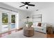 Bright living room with white couch, area rug, French doors and backyard views at 432 39Th Ne Ave, St Petersburg, FL 33703