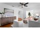 Bright living room featuring white walls, hardwood floors, stylish furnishings, and abundant natural light at 432 39Th Ne Ave, St Petersburg, FL 33703