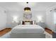 Well-lit main bedroom featuring stylish lamps, modern art and comfortable bed at 432 39Th Ne Ave, St Petersburg, FL 33703