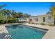 Backyard pool with modern poolhouse and parked Airstream trailer in background at 432 39Th Ne Ave, St Petersburg, FL 33703