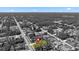 Overhead view pinpoints a colorfully highlighted property within a lush, wooded neighborhood at 4344 Eldron Ave, North Port, FL 34286