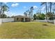 Expansive backyard with a vinyl privacy fence, patio, and hot tub at 4344 Eldron Ave, North Port, FL 34286