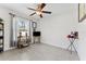Spare bedroom featuring tile floors, a ceiling fan and a window at 4344 Eldron Ave, North Port, FL 34286