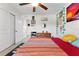Bedroom featuring tiled floor, ceiling fan, and a doorway at 4344 Eldron Ave, North Port, FL 34286