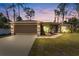 Charming single-story home featuring a two-car garage, well-maintained landscaping, and a cozy front entrance at 4344 Eldron Ave, North Port, FL 34286
