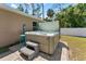 Backyard hot tub with steps and stone paver base at 4344 Eldron Ave, North Port, FL 34286