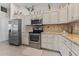 Well-equipped kitchen with stainless steel appliances, granite countertops, and plenty of cabinet space for storage at 4344 Eldron Ave, North Port, FL 34286